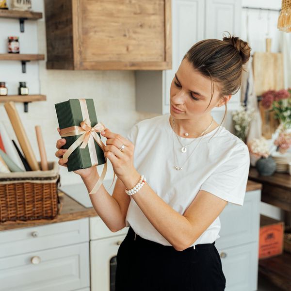 Person incorporating a small stretching routine at their modern home office desk.